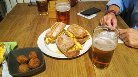 Tortilla sandwiches in Euskadi (Basque Country) paired with beerの写真素材