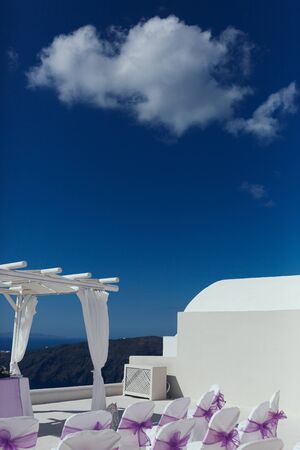 Part of the white wedding location with a blue sky and a beautiful cloudの写真素材