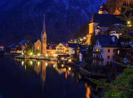 Classic postcard night view of Hallstatt alpine village on Hallstatt Lake, Hallstatt, Austriaの写真素材