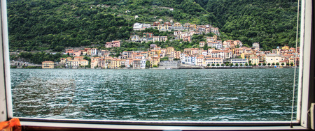 Panoramic View of the village on the boat in Lake Como, Italyの写真素材