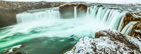 Majestic winter morning panoramic scene on the Godafoss, Waterfall of god, Bárðardalur district, Iceland, Europe. Natural beauty of water falls from Skjalfandafljot river and Bárðardalur valley as background.の写真素材