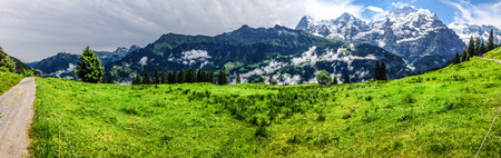 Spectacular panoramic view of Eiger, Monch, Jungfrau mountains from Murren-Gimmelwald trail, Swiss alps, Bernese Oberland, Berne Canton, Switzerland, Europe. Great outdoor trail, best scenery for family activities, start from Lauterbrunnen station.の写真素材
