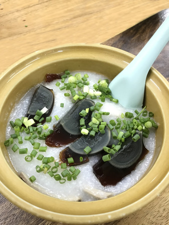 Congee, Rice Porridge, Rice Gruel, Conjee or Rice Soup topped with century or one thousand year egg....
