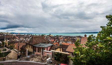 Top view of the medieval town Neuchatel with Lake Neuchatel and the Bernese Alps Chaumont seen on the horizon.の写真素材