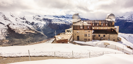 Majestic Dreamy View of snowy Gornergrat station and Matterhorn shrouded with clouds, Zermatt, Switzerland, Europe.のeditorial素材