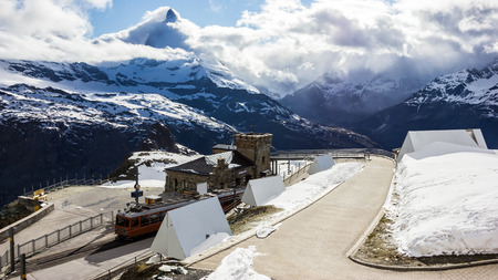 Majestic Dreamy View of snowy Gornergrat station and the iconic Matterhorn Peak shrouded with clouds, Zermatt, Switzerland, Europe.のeditorial素材