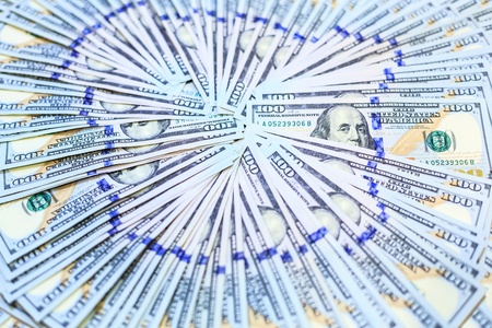 stacks of One Hundred Dollars notes fans in circle pattern, New Design of 100 USD Banknotes Backgroundの写真素材