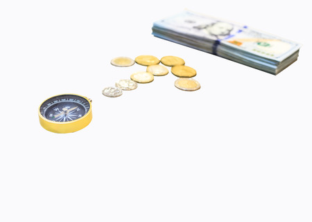 golden compass guiding coin arrow the right direction to wealth, isolated on white background with...