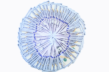 stacks of One Hundred Dollars notes fans in circle pattern, New Design of 100 USD Banknotes isolated on white background with clipping pathの写真素材
