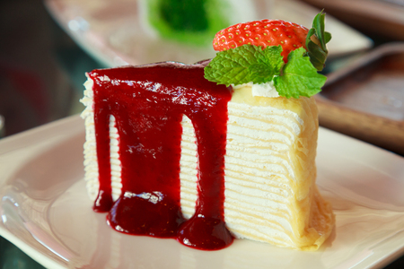 Sweet Dessert: Delicious Tropical Seasonal Fresh red strawberries fruit topping on Crepe Layer Cake. Healthy sweet dessert, Food and Beverage, Stress Therapy.の写真素材