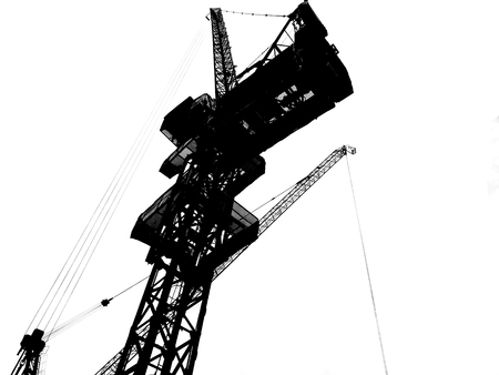Construction tower crane silhouette isolated on white background. Construction Industry, Transportation Industry, Engineering Tool and Industrial Equipment, Loading and Lifting Cargo Material concept.の写真素材