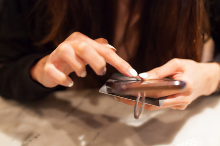 Woman pays for online shopping by credit card, smart phone digital wireless internet technology. Modern Trend, Lifestyle, Business Transaction, Communication, Artificial Society and Mobile App conceptの写真素材
