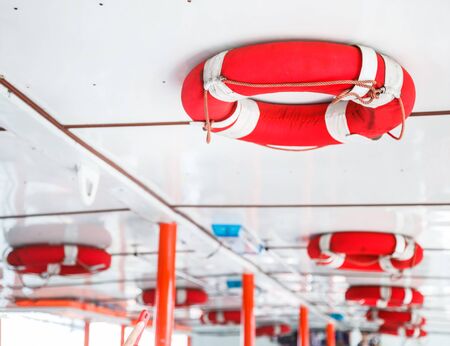 Personal life support flotation safety device (life buoy) for swimmers, passengers or marine personnel working on boat or area exposed to water. Drowning Protection Equipment for Marine Transportationの写真素材