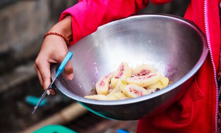 Traditional Thai Asian Dessert, Steamed Banana Cake or Pudding (Kanom Gluay) in street food market....