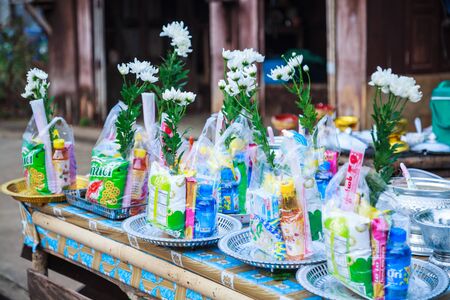 Kanchanaburi, Thailand - December 30, 2018: Alms prepared for Almsgiving (food offerings) to Buddhist monks going on daily alms round in the morning at Mon Bridge, Sangkhlaburi, Kanchanaburi, Thailandのeditorial素材