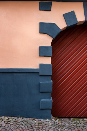 Gateway to the old house and wall fragment. Rigaの写真素材