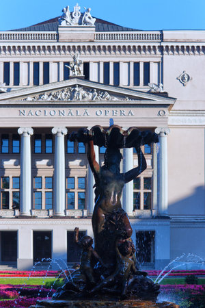 Fountain woman with flowers and angels in the building of the Latvian National Opera in Riga with columnsのeditorial素材