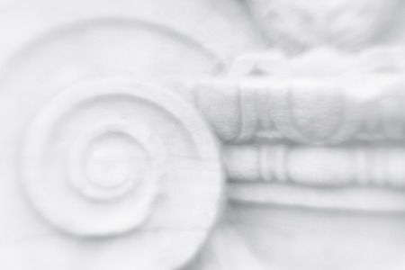 Harmonious fragment of ancient columns in a bright high-key image of a spiral. Blurryの写真素材