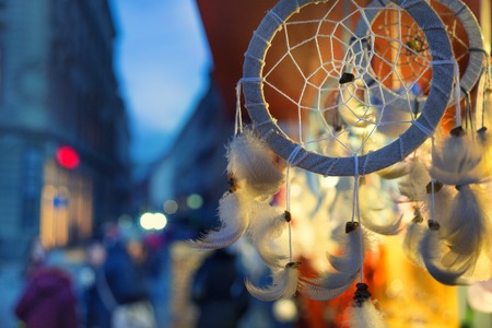 Shopping stall in the evening in bright lights with handmade souvenirs at the Christmas Fair in Rigaの写真素材