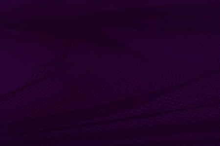 Decorative mesh with folds in red light against the wall backgroundの写真素材