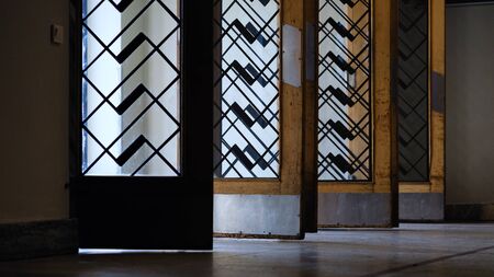 Open wooden doors in the lobby of the historic station in the center of Riga. Latvia
