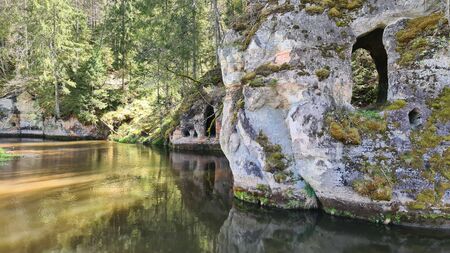 Sand cliffs by the river in Gauja National Park in the fall. Ligatne, Latviaの写真素材