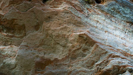 Beautiful background of sandy rocks. Wallpaper made of ancient sand in the form of bizarre shapes. Stunning natural yellow rock background made by wind. Latviaの写真素材