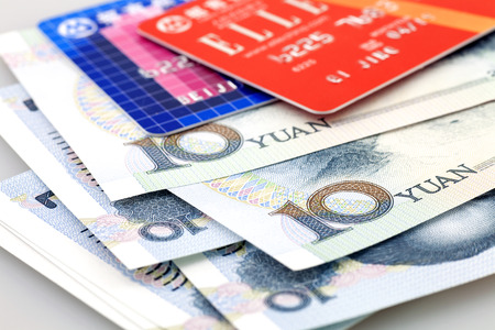 Two credit cards and chinese banknotesのeditorial素材
