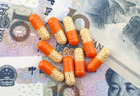 Capsule and money for medical conceptsの写真素材