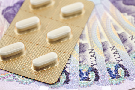 Five yuan banknotes and drugsの写真素材