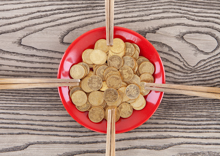 A set of coins and four pairs of chopsticksの写真素材