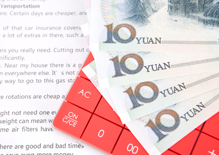 Calculator in English and Chinese currencyの写真素材