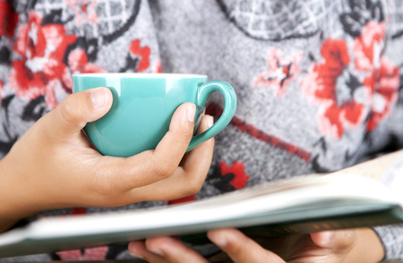 A girl with coffee in her hand