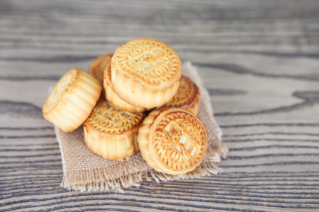 A pile of moon cakes on the wooden tableの写真素材