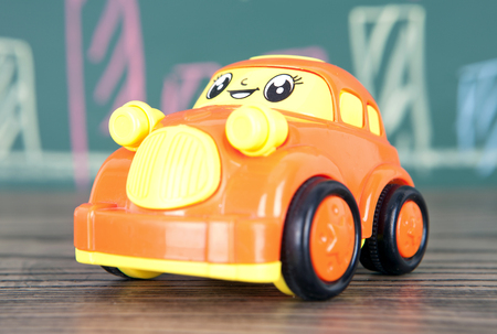 Toy car on wooden floorの写真素材