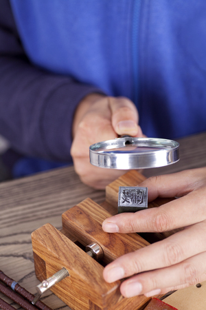 Close up view of carving a seal copのeditorial素材