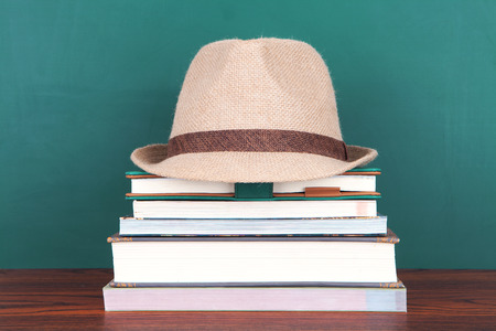 Education concept with a hat and book stackの写真素材