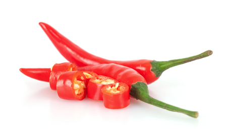 Hot peppers and cut peppersの写真素材