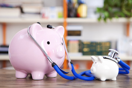 Piggy bank and stethoscopeの写真素材