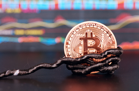 A bit of bitcoin tied to a ropeの写真素材