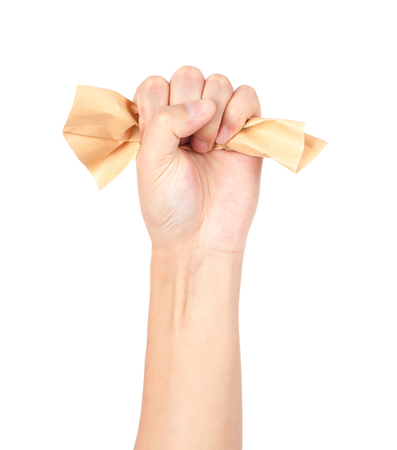 A hand clutching paperの写真素材