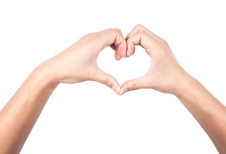 The hand placed into the heart shapedの写真素材