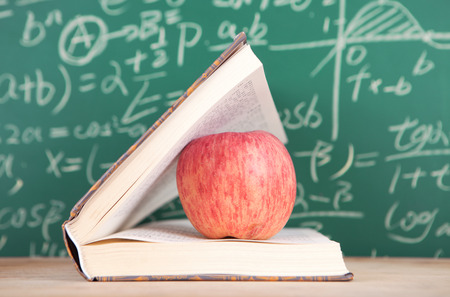 A book with an apple