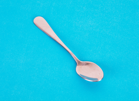 Spoon on blue backgroundの写真素材