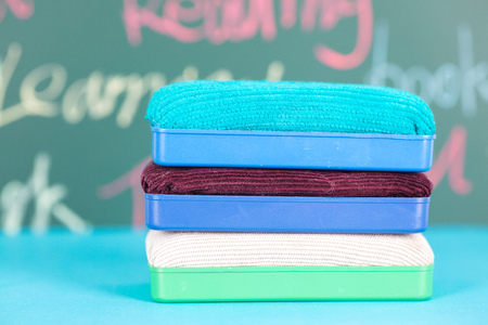 Board eraser in front of the blackboardの写真素材