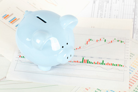Piggy bank with financial chartの写真素材