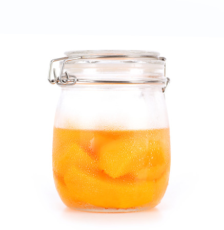 a bottle jar of canned peachの写真素材