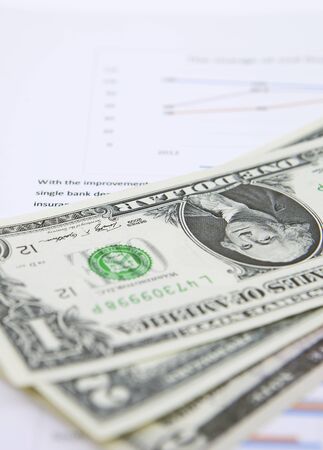 financial concept with banknotes and statement reportの写真素材