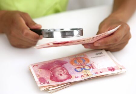 Lady viewing banknotesの写真素材