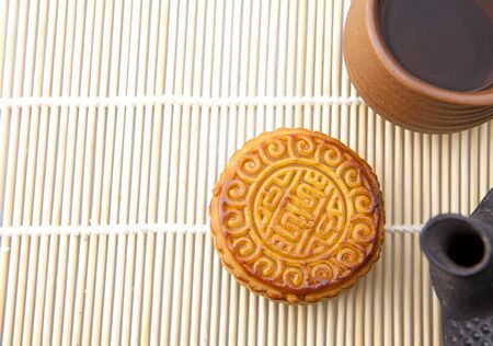 Moon cakes with tea, refreshments of mid autumn festivalの写真素材